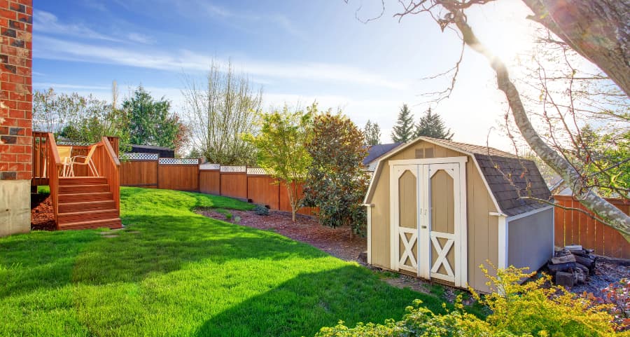 Fenced backyard with storage shed in Houston